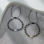 Pulsera apilable de hematita con decoración de cruz (2 piezas)