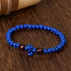 Pulsera de Cuerda con Nudo y Cruz Azul y Negra: Un Símbolo de Fe