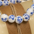 Pulsera Floral de Perlas Azules y Blancas con Medalla Milagrosa