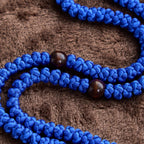 Collar de Cuerda con 100 Nudos de Bendición en Cruz Azul y Negro: Símbolo Apreciado de Bendición Sagrada