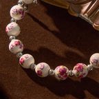 Pulsera Elástica Cerámica Floral Multicolor con Medalla Milagrosa y Crucifijo: Elegancia Sutil de Fe