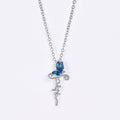 Conjunto de Joyería Cruz de Mariposa: Devoción y Simbolismo Artístico