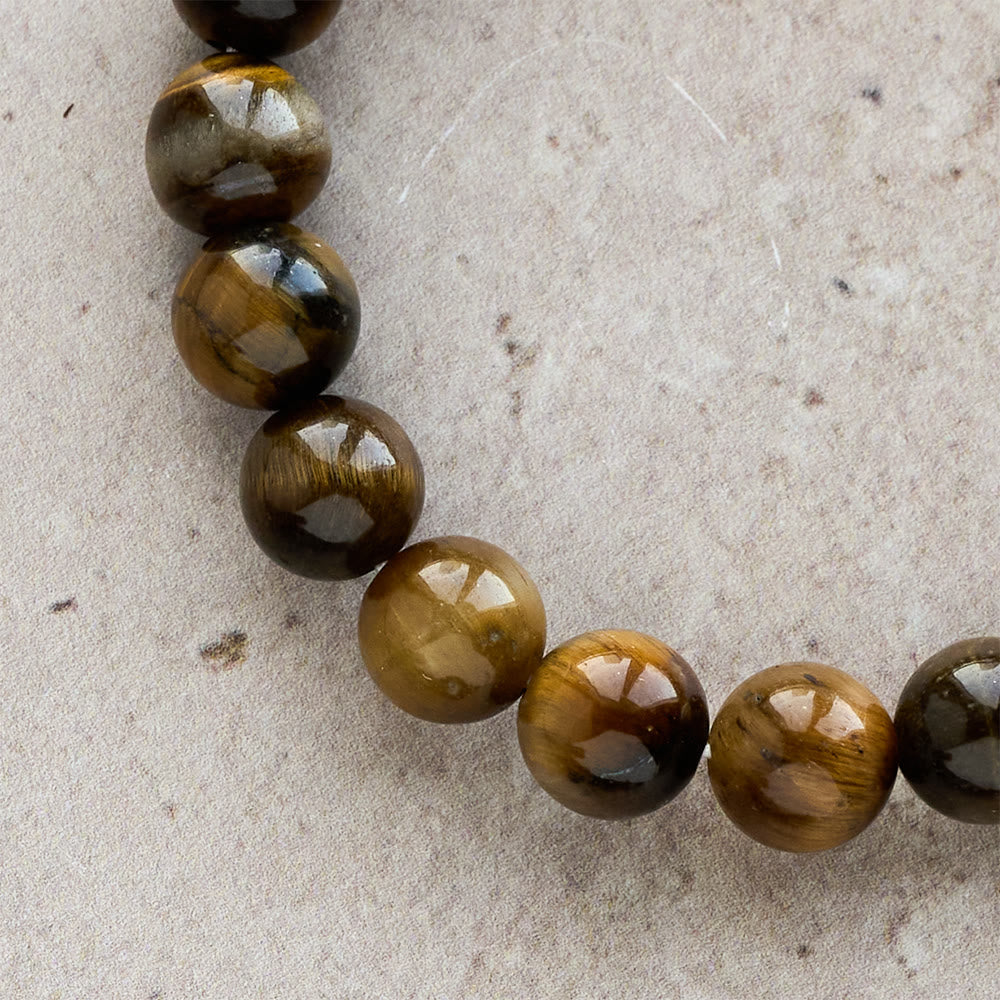 Pulsera Estilo Rosario de Ojo de Tigre: Piedra de Toque para la Reflexión