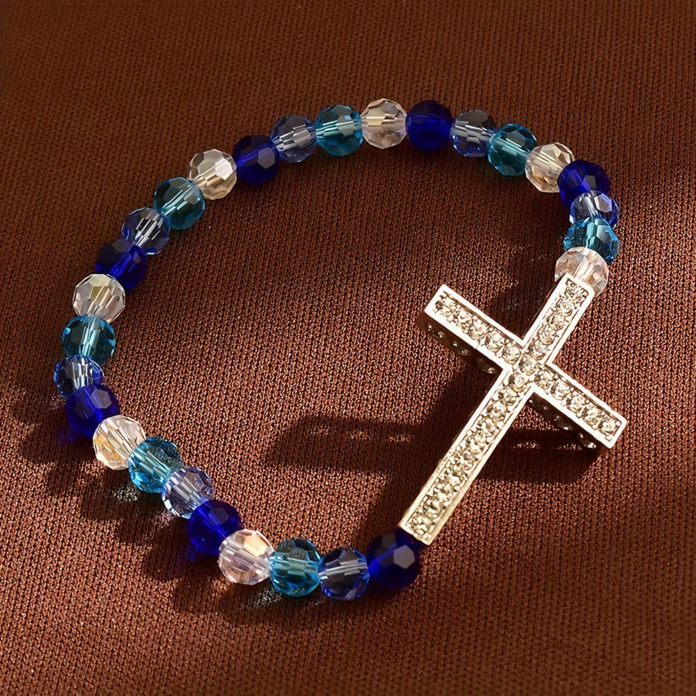 Pulsera Cruz Blanca y Azul Pavo Real: Creencia Envuelta en Brillo