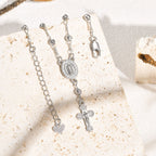 Pulsera con Colgante de Nuestra Señora y Crucifijo: Su Gracia en Tu Muñeca