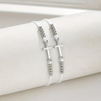 Pulsera de cuentas con cruz intrincada: Tejida con fe, gracia y amor inquebrantable